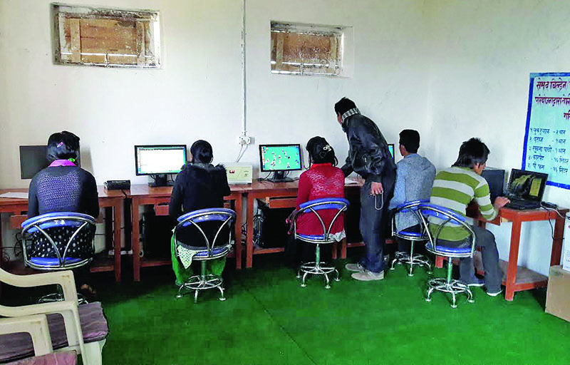 Youths learning computer skills at an information centre in Toli VDC, Bajura, on Saturday, February 11, 2017. Photo: THT