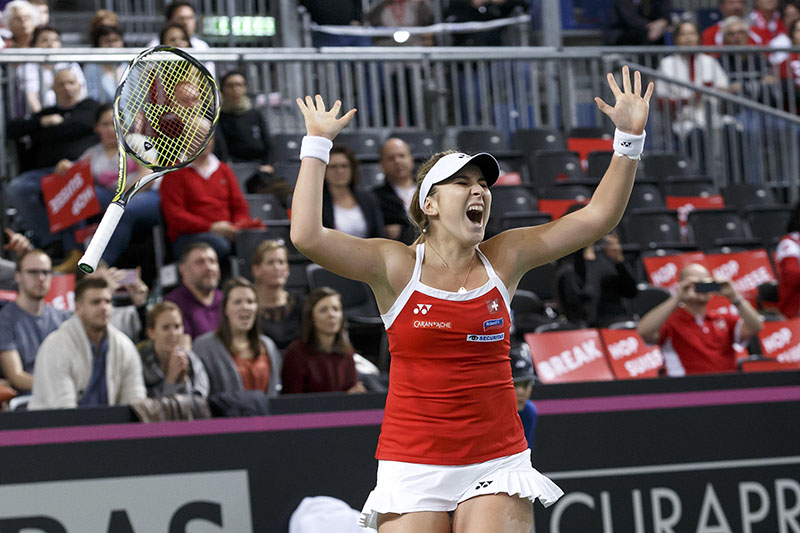 Belinda Bencic of Switzerland celebrates her victory after beating Pauline Parmentier of France, during the fourth single tennis match of the Fed Cup World Group first round match between Switzerland and France, at Palexpo, in Geneva, Switzerland, on Sunday, February 12, 2017.  Photo: Salvatore Di Nolfi/Keystone via AP