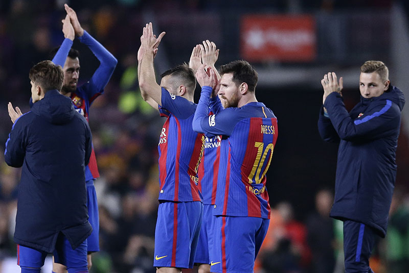 Barcelona's Lionel Messi (center right) and his teammates applaud the supporters at the end of the the Copa del Rey semifinal second leg soccer match between FC Barcelona and Atletico Madrid at the Camp Nou stadium in Barcelona, Spain, on Tuesday, February 7, 2017. The game ended in a 1-1 draw and Barcelona advances to the final after a first leg 2-1 win. Photo: AP
