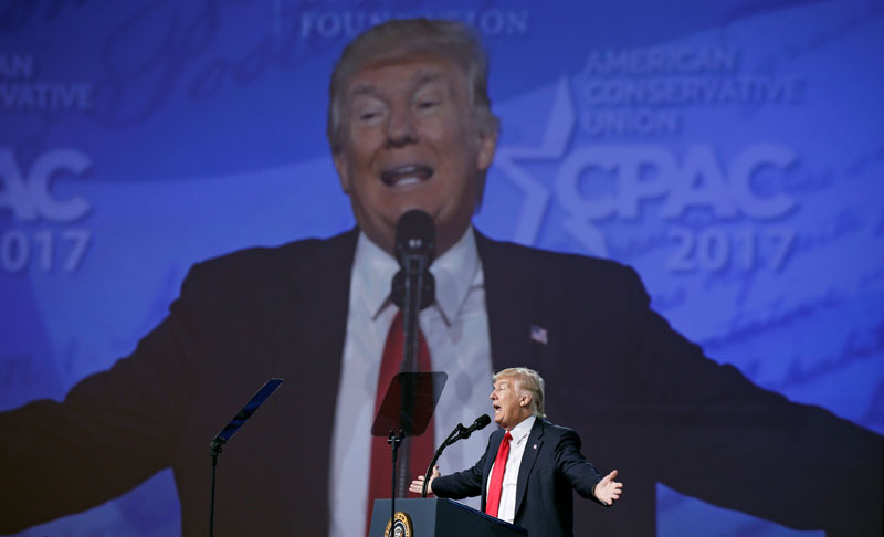 With his image projected upon a huge screen, US President Donald Trump speaks at the Conservative Political Action Conference, or CPAC, in Oxon Hill, Maryland, US, on February 24, 2017. Photo: Reuters