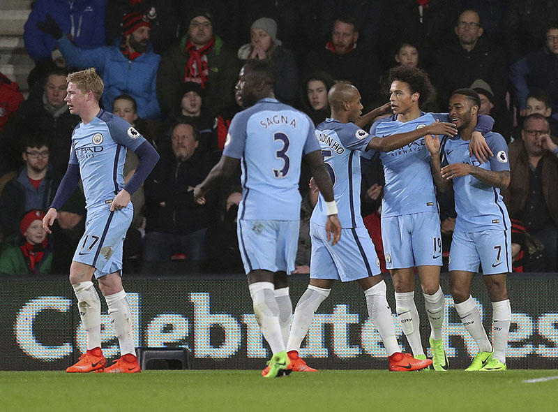 Manchester City's Raheem Sterling (right) celebrates scoring his sides opening goal during their English Premier League football match against Bournemouth, at the Vitality Stadium in Bournemouth, England, on Monday, February 13, 2017. Photo: Andrew Matthews/PA via AP