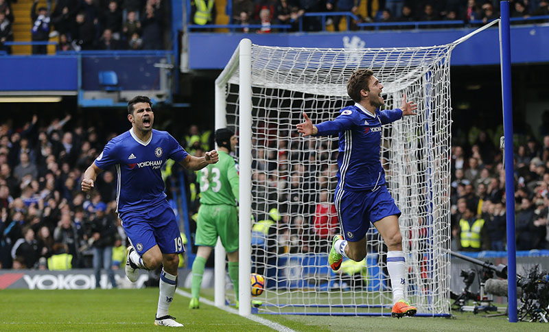 Chelsea's Marcos Alonso (right) celebrates after scoring the opening goal of the game during the English Premier League soccer match between Chelsea and Arsenal at Stamford Bridge stadium in London, on Saturday, February 4, 2017. Photo: AP