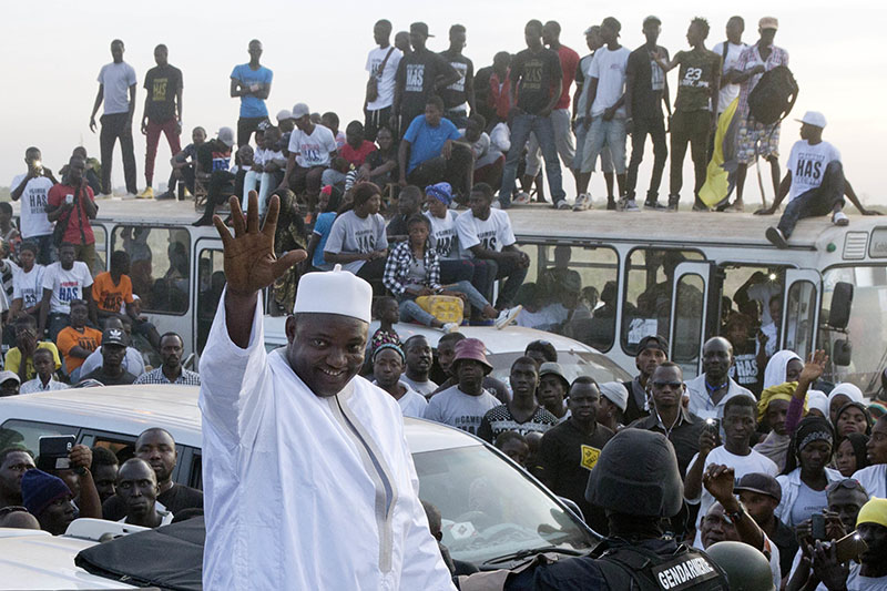 FILE - Gambia President Adama Barrow waves as he rides his motorcade through crowds of hundreds of thousands after arriving at Banjul airport in Gambia, after flying in from Dakar, Senegal, on Thursday, January 26, 2017. Photo: AP