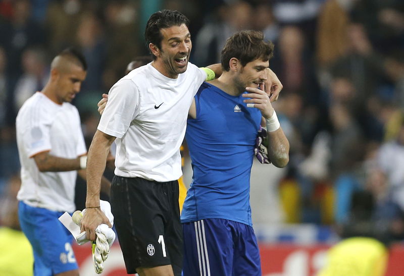 FILE - This Oct. 23, 2013 file photo shows Juventus goalkeeper Gianluigi Buffon, left, sharing a laugh with then Real Madrid goalkeeper Iker Casillas at the end of a Group B Champions League soccer match between Real Madrid and Juventus at the Santiago Bernabeu stadium in Madrid, Spain. Photo: AP