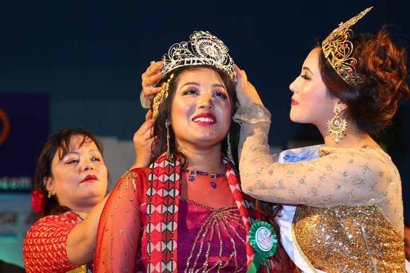 Ishu Shrestha is crowned the 12th Miss Newa 1137 by her predecessor Angel Shrestha, in Kathmandu, on Wednesday, February 8, 2017. Photo: Nepalese Fashion Home