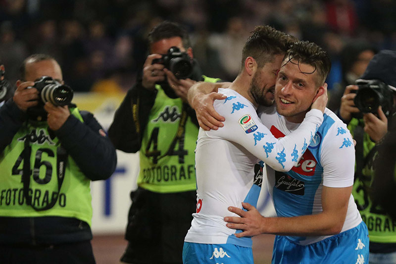 Napoli's midfielder Emanuele Giaccherini (right) celebrates embracing his teammate Dries Martens after scoring a goal during the Italian Serie A soccer match between Napoli and Genoa at the San Paolo stadium in Naples, Italy, on Friday, February 10 2017.  Photo: Cesare Abbate/ANSA via AP