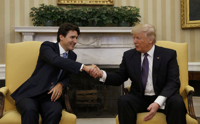 Canadian Prime Minister Justin Trudeau (left) shakes hands with US President Donald Trump in the Oval Office at the White House in Washington, US, on February 13, 2017. Photo: Reuters