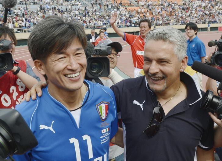 Former Italy striker Roberto Baggio (R) who participated as coach of the Italian legends Glorie Azzurre team, talks with Kazuyoshi Miura, J-League soccer player who participated in both J-League Legend and played for the Italian team for this game, after their exhibition match at the National Stadium in Tokyo June 9, 2013.  Mandatory Credit. REUTERS/Kyodo/File Photo