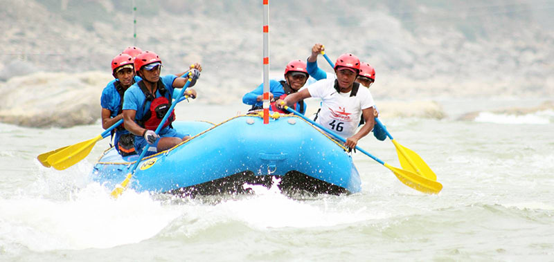 Participants rowing their rafting boat during the Slalom Race in the National Rafting Championship at the Trishuli River in Fishling, on Thursday, February 16, 2017. Photo: THT