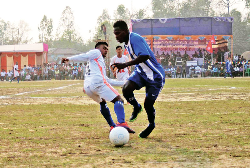 Players of Nepal APF Club and CMG Club Sankata vie for the ball during their friendly match at the Hirapur football grounds in Sarlahi on Saturday, February 18, 2017. Photo: THT