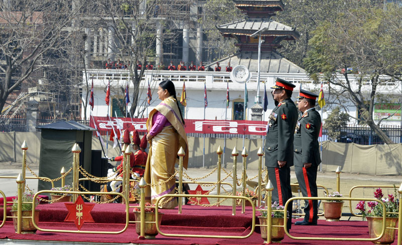 President Bidya Devi Bhandari stands on a stage during a salute at a special function organised by the Nepal Army to mark the Nepal Army Day at the Army Pavilion, Tundikhel, on Friday, February 24, 2017. Photo: PM's Secretariat