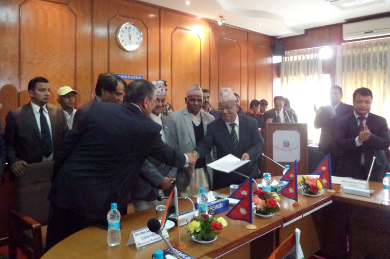 Indian Ambassador to Nepal Ranjit Rae and Secretary at the Ministry of Physical Infrastructure and Transport Dhan Bahadur Tamang shake hands after signing an MoU, at the Ministry of Physical Infrastructure and Transport in Kathmandu, on Sunday, February 19, 2017. Photo: RSS
