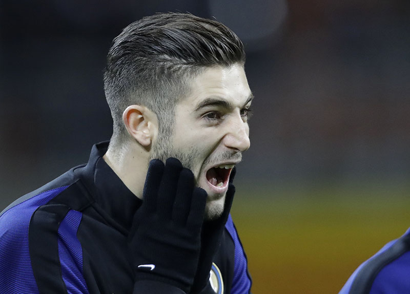 Inter Milan's Roberto Gagliardini touches his face before a Serie A soccer match between Inter Milan and Chievo, at Milan's San Siro stadium, Italy, on Saturday, January 14, 2017. Photo: AP