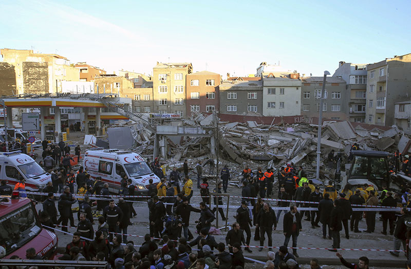 Rescue teams and firefighters search for possible survivors in the debris of a collapsed building in the Zeytinburnu district of Istanbul, on Friday, January 13, 2017. Photo: AP