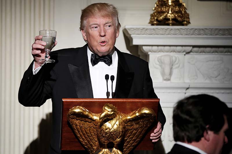 Host US President Donald Trump, makes a toast during a dinner reception for the annual National Governors Association winter meeting at the State Dining Room of the White House, in Washington on Sunday, February 26, 2017. Photo: AP