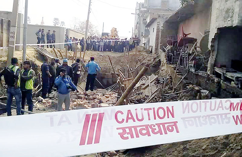Locals gather to see the drainage construction site where a wall collapse incident killed a worker and injured other three in Birgunj of Parsa district on Saturday, February 18, 2017. Photo: Ram Sarraf