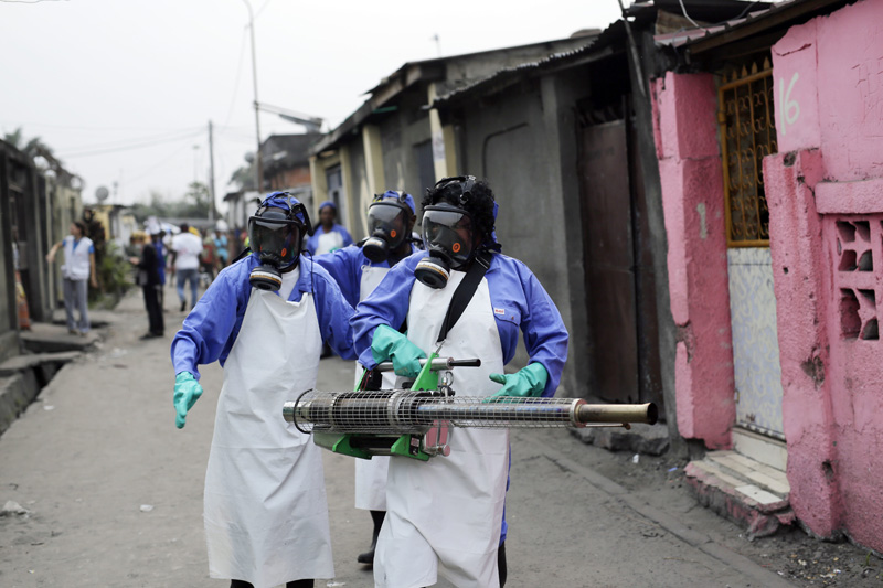 FILE - In this Friday, July 22, 2016, file photo teams from MSF carry out fumigation efforts in the Yolo Sud neighborhood of Kinshasa, Democratic Republic of Congo, in a bid to kill the mosquitos that transmit yellow fever. Photo: AP