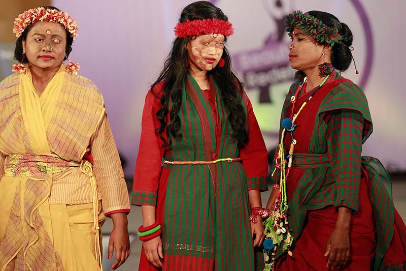 Bangladeshi acid attack survivors walk down the ramp during the event 'Beauty Redefined' in Dhaka, Bangladesh on March 7, 2017. Photo: AP