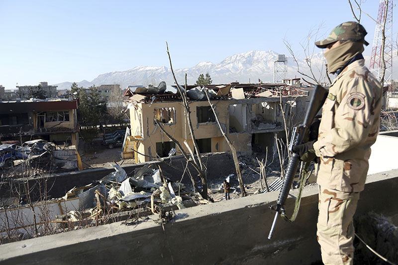 A member of Afghan security forces stand guard at district police headquarters in Kabul, Afghanistan, on Thursday, March 2, 2017, a day after suicide attacks and shooting. Photo: AP
