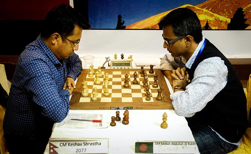 Nepalu2019s CM Keshav Shrestha (left) and Bangladeshu2019s GM Mollah Abdullah Al Rakib ponder their moves during the Asian Zonal 3.2 Chess Championship in Kathmandu on Sunday, March 26, 2017. Photo: THT