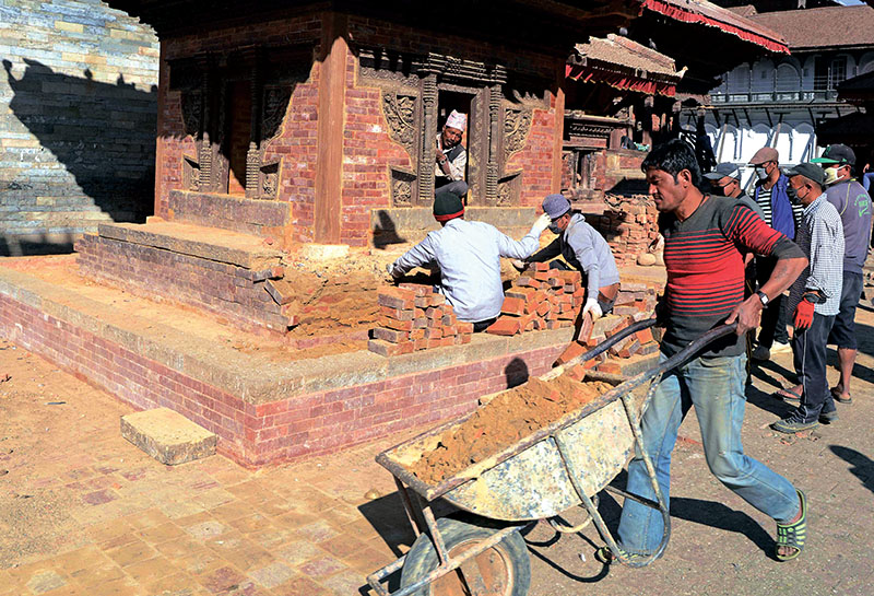 Workers renovating a heritage site at Basantpur Durbar Square in Kathmandu on February 8, 2017. Photo: AFP