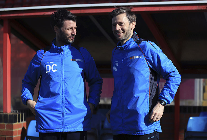Lincoln City manager Danny Cowley (left) speaks with assistant manager and brother Nicky at Sincil Bank, Lincoln, England, Thursday, March 9, 2017. Photo: Mike Egerton/PA via AP
