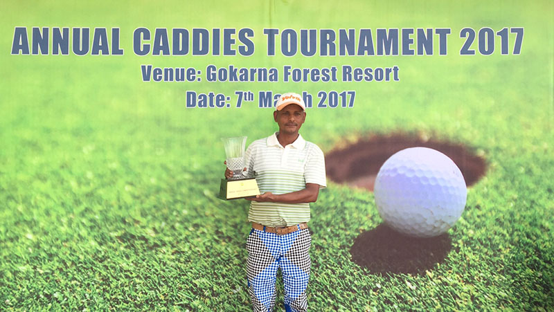 Bishnu Bhandari holds the trophy after winning the Gokarna Annual Caddie Competition at the Gokarna Golf Club on Tuesday, March 7, 2017. Photo Courtesy: Gokarna Golf Club