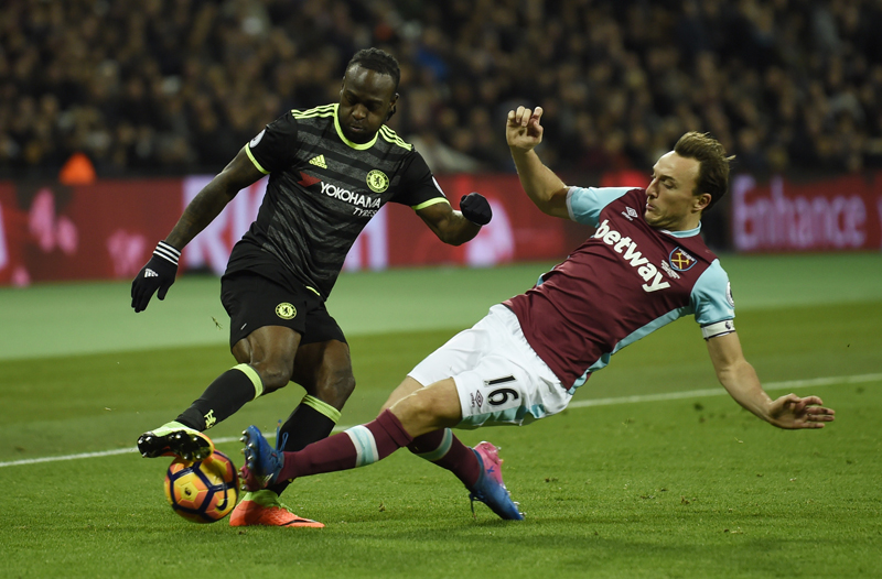Chelsea's Victor Moses in action with West Ham United's Mark Noble. Photo: Reuters
