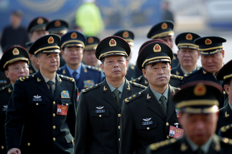 Military delegates from the Chinese People's Liberation Army (PLA) walk toward the Great Hall of the People for a meeting during the annual session of China's parliament, the National People's Congress (NPC), in Beijing, China, on March 4, 2017. Photo: Reuters