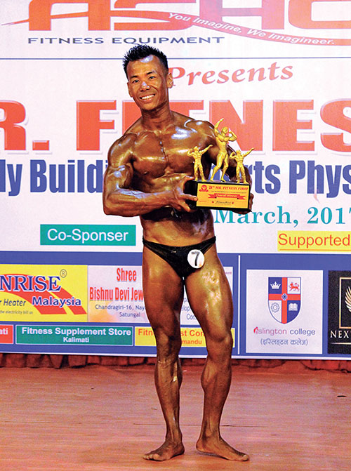 Dharma Raj Limbu holds the trophy after winning the Mr Fitness First Open Bodybuilding Championship on Saturday, March 18, 2017. Photo: THT