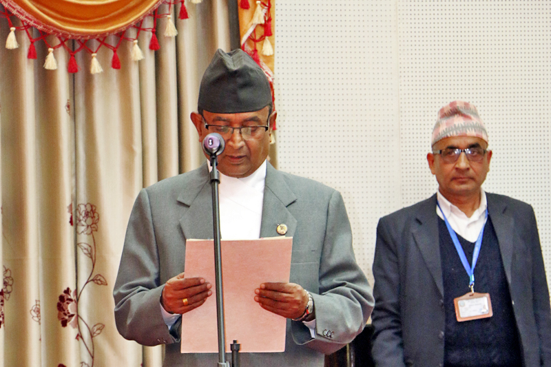 Newly appointed Minister for Culture, Tourism and Civil Aviation Dilnath Giri takes the oath of office and secrecy from President Bidya Devi Bhandari at the Sheetal Niwas in Kathmandu, on Thursday, March 9, 2017. Photo: RSS
