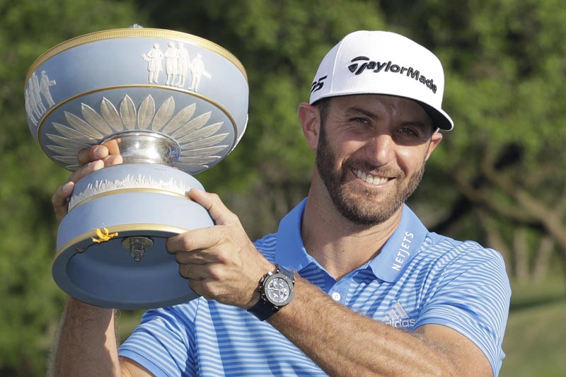 Dustin Johnson holds his trophy after defeating Jon Rahm of Spain at the Dell Technologies Match Play golf tournament at Austin County Club, Sunday, March 26, 2017, in Austin, Texas. Photo: AP