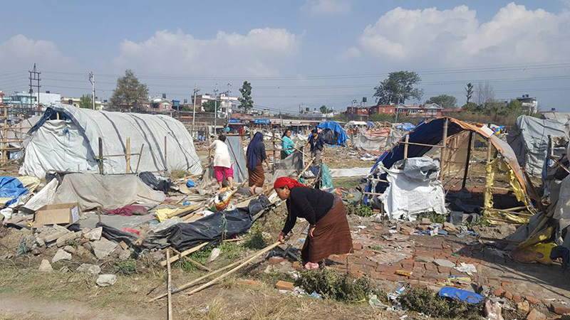 The dwellers of temporary huts saves their belonging at Chuchepati, Kathmandu, on Tuesday, March 14, 2017. Police in riot gear used bulldozers to tear down about 440 huts in Kathmandu without providing any alternative living options. Photo courtesy: Karma Sherpa