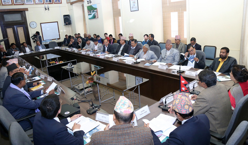 Chief Election Commissioner Dr. Yaodhi Prasad Yadav along with other high officials, briefs about the election code of conduct for local polls to the Deputy Prime Minister and Minister for Home Affairs Bimalendra Nidhi, at a meeting held at Election Commission, in Kathmandu, on Wednesday, March 1, 2017. Photo: RSS