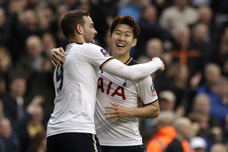 Tottenham's Heung-Min Son celebrates with Vincent Janssen (left) after scoring his third goal during the English FA Cup quarterfinal soccer match between Tottenham Hotspur and Millwall FC at White Hart Lane stadium in London, on Sunday, March 12, 2017. Photo: AP