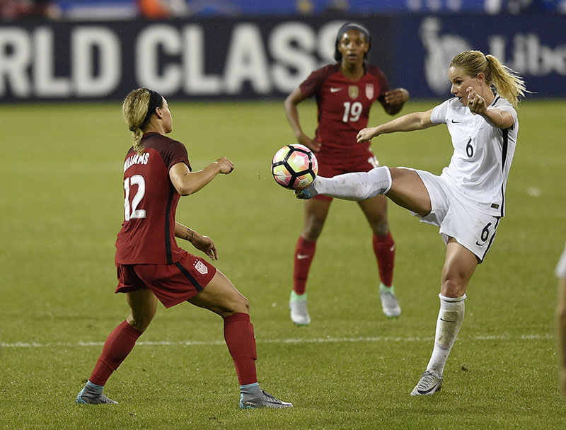 France midfielder Amandine Henry (6) kicks the ball against United States forward Lynn Williams (12) during the second half of a SheBelieves Cup women's soccer match, on Tuesday, March 7, 2017, in Washington. Also seen is United States forward Crystal Dunn (19). France won 3-0. Photo: AP