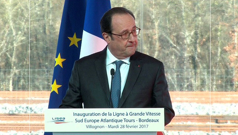 French President Francois Hollande, seen in this still image taken from video, reacts after a shot was fired by a police sharpshooter that accidentally wounded two people while he was giving a speech in Villognon, in the southwest of France, February 28, 2017. Photo: Agency Pool  via Reuters