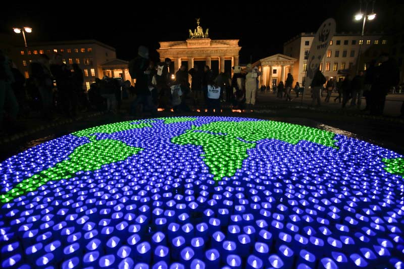 A globe illuminated with led-lights by activists of the World Wide Fund For Nature (WWF) in front of the Brandenburg Gate to mark Earth Hour, in Berlin, on Saturday, March 25, 2017. Photo: AP