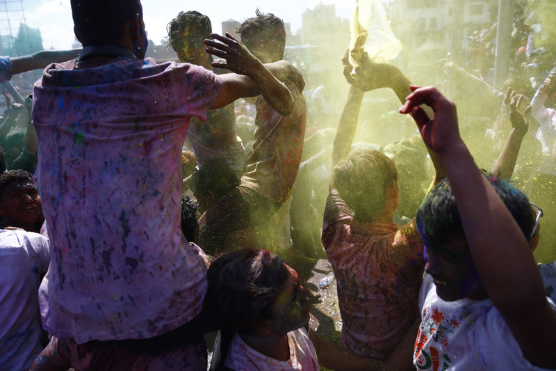 People are seen dancing while celebrating Holi in Kathmandu, on Sunday, March 12, 2017. Photo: Skanda Gautam