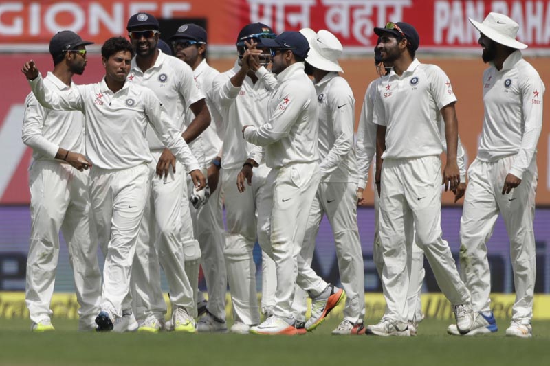 India's Kuldeep Yadav, second left, and his teammates celebrate the dismissal of Australia's Glenn Maxwell during the first day of their fourth test cricket match in Dharmsala, India, Saturday, March 25, 2017. Photo: AP