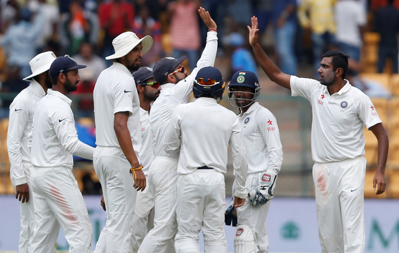 India's Ravichandran Ashwin (R) celebrates the wicket of Australia's Mitchell Marsh with teammates. Photo: Reuters
