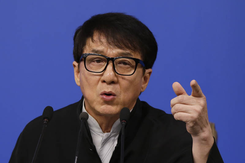 Hong Kong movie star Jackie Chan, delegate to the Chinese People's Political Consultative Conference gestures as he speaks at a press conference on the sideline of the CPPCC at the media center in Beijing, Tuesday, March 7, 2017. Photo: AP