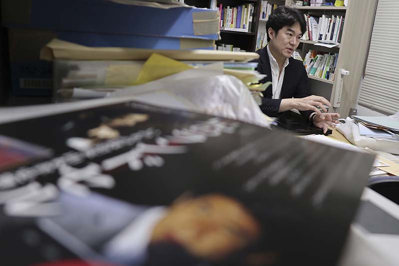 Yasuyuki Shimizu, founder of Lifelink, a nonprofit that lobbies for suicide-prevention measures, speaks during an interview at his office in Tokyo, on March 2, 2017. Photo: AP