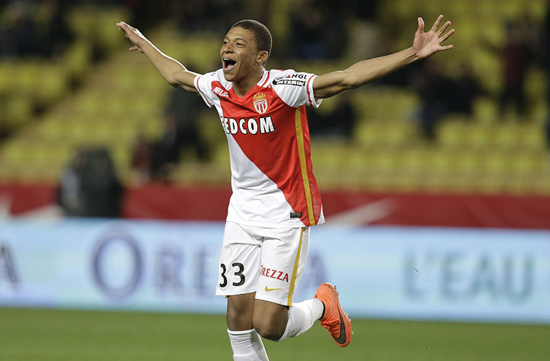 FILE - Monaco's Kylian Mbappe Lottin celebrates scoring the third goal against Troyes during their French League One soccer match, in Monaco, on Saturday, February 20, 2016. Photo: AP