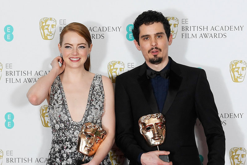 Emma Stone and Damien Chazelle hold their awards for 'La La Land' at the British Academy of Film and Television Awards (BAFTA) at the Royal Albert Hall in London, Britain, February 12, 2017. Photo: Reuters