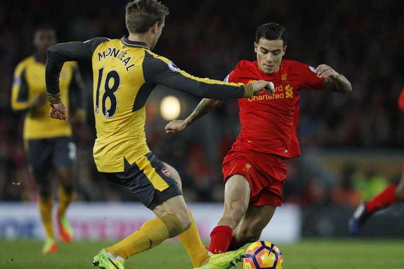 Arsenal's Nacho Monreal in action with Liverpool's Philippe Coutinho. Photo: Reuters
