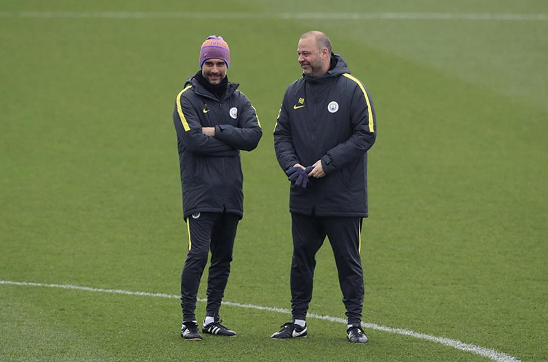 Manchester City manager Pep Guardiola (left) and head of coaching Rodolfo Borrell talk, during the training session at the City Football Academy, in Manchester, England, on Tuesday March 14, 2017. Manchester City will play Monaco in a second leg Champions League Round of 16 soccer match on Wednesday. Photo: Peter Byrne/ PA via AP