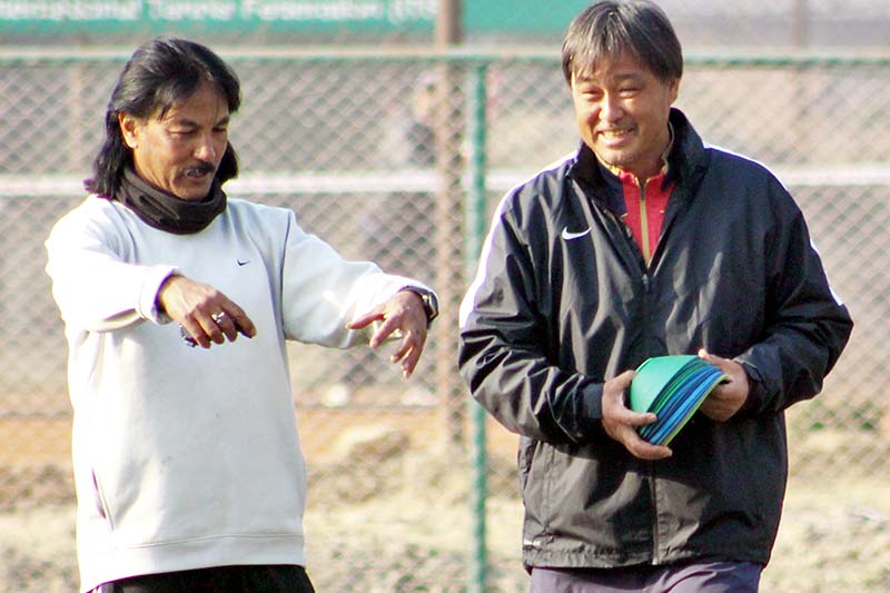 Coaches Gyotoku Koji (right) and Raju Kaji Shakya share light moments during a training session of the national football team in Lalitpur on Friday, March 10, 2017. Photo: THT