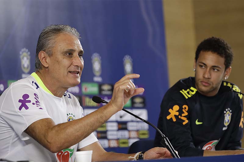 Brazil's coach Tite speaks as Neymar listens on, during a press conference after a training session in Sao Paulo, Brazil, on Monday, March 27, 2017. Photo: AP