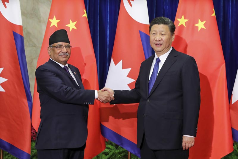 Nepal's Prime Minister Pushpa Kamal Dahal, left, and Chinese President Xi Jinping pose for a photo before a meeting at the Great Hall of the People in Beijing Monday, March 27, 2017. Photo: AP